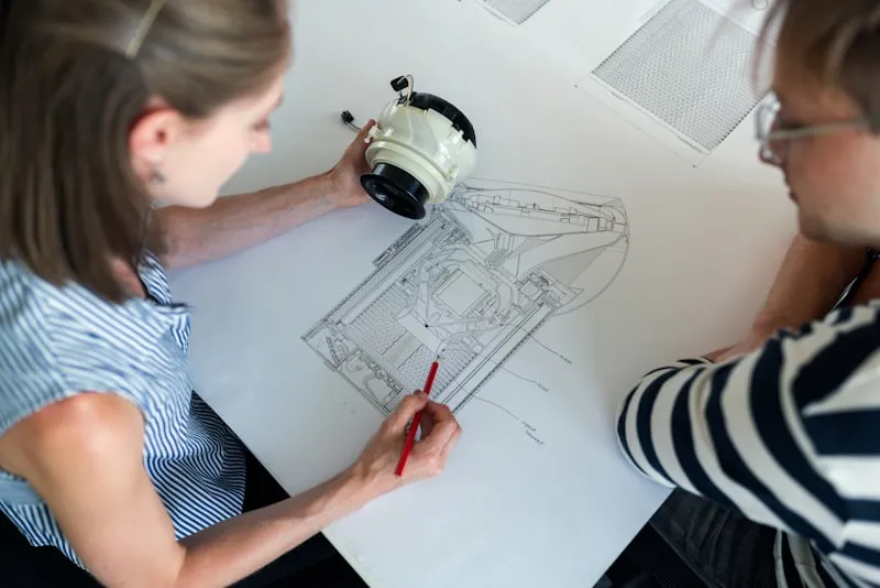 AL BURKAN engineering team reviewing equipment technical drawings